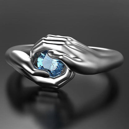 Exquisite Hands Embrace Blue Crystal Zircon Ring