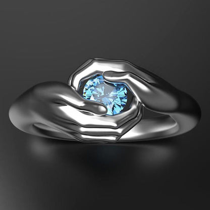 Exquisite Hands Embrace Blue Crystal Zircon Ring